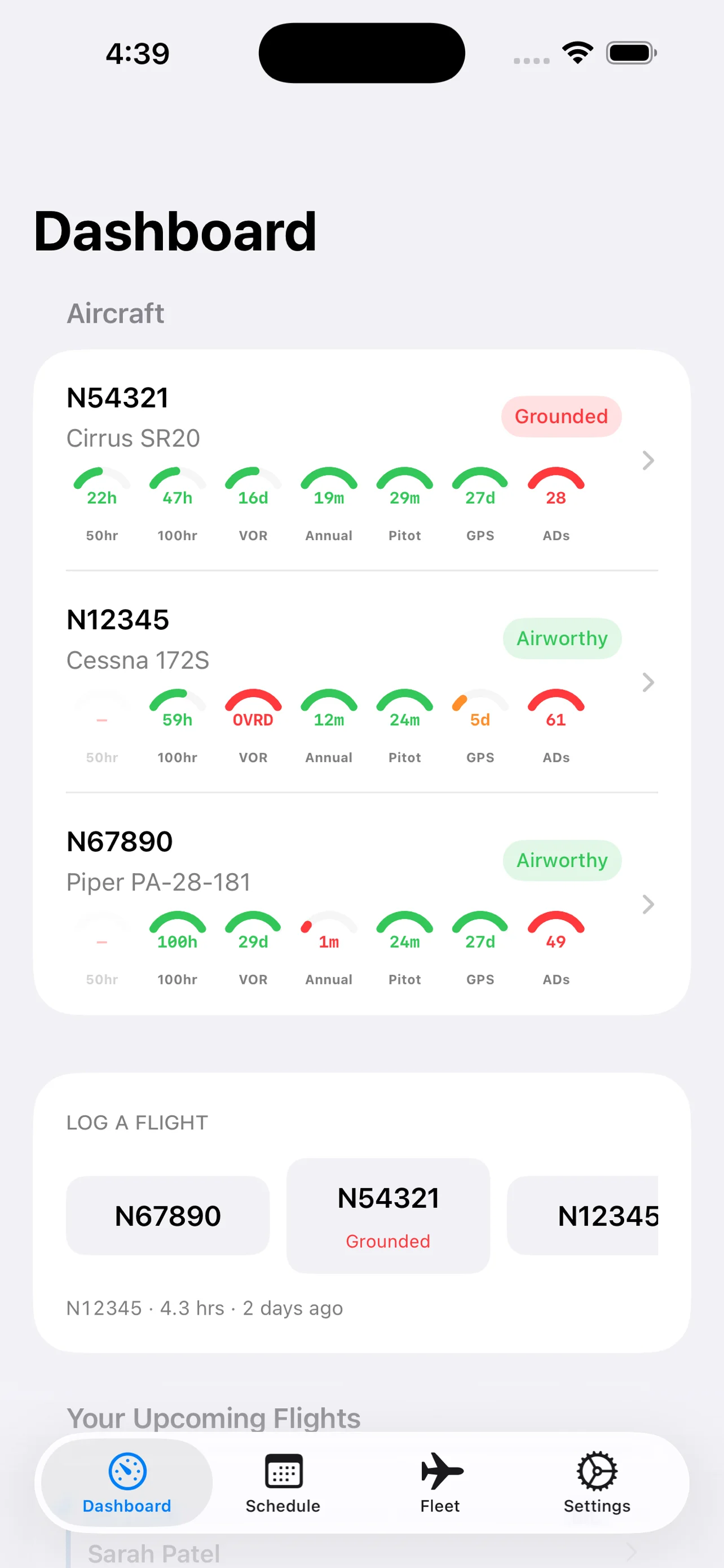 TieDown Dashboard on iPhone — fleet roster with airworthiness status and compliance gauges per aircraft